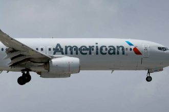 American Airlines plane catches fire at Denver airport gate; passengers evacuated on slides