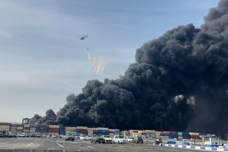 Explosion at southern Iran port linked to missile fuel shipment kills 14, injures 750
